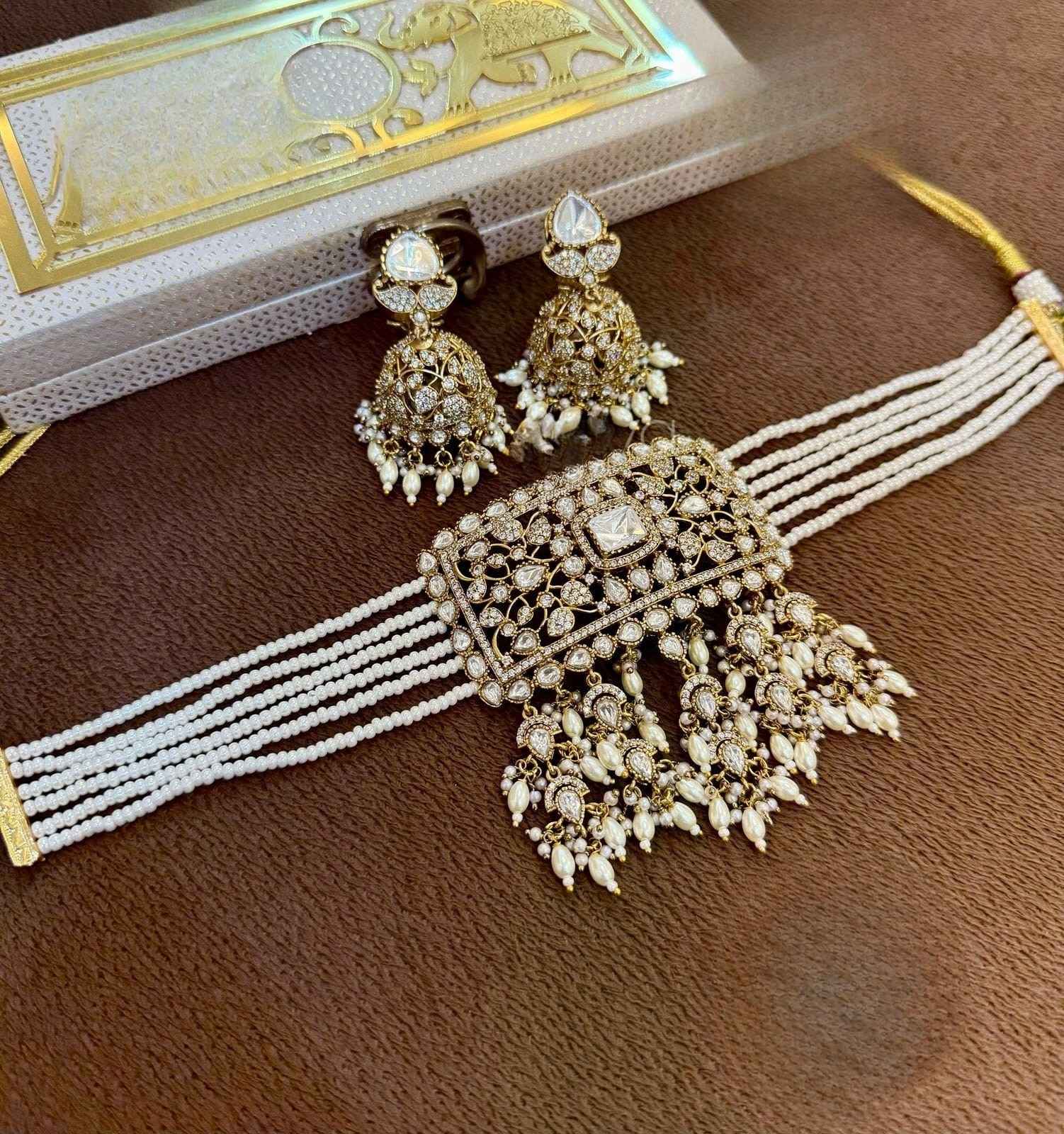 White Pearl Beaded Kundan Choker with Gold Jhumka Earrings
